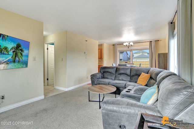 living room with light carpet, a chandelier, and baseboards