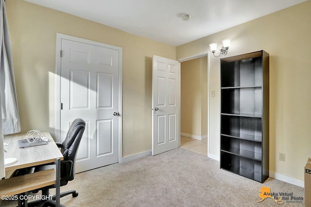 home office with light colored carpet and baseboards