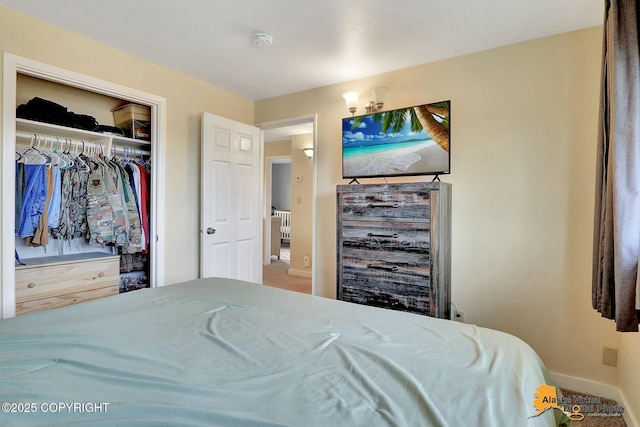 bedroom featuring a closet and baseboards