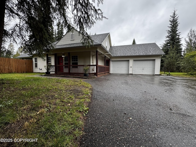 view of front facade with a garage and a front lawn