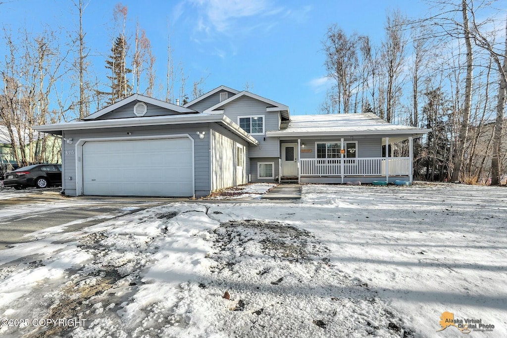 view of front facade featuring a garage and covered porch