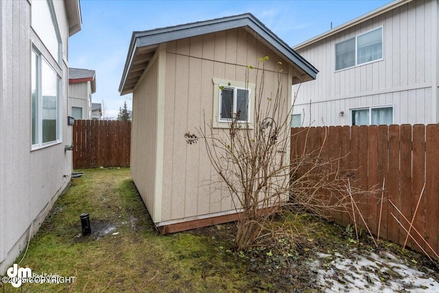 view of property exterior featuring a yard and a storage shed