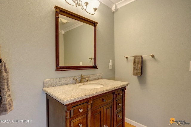 bathroom with baseboards and vanity