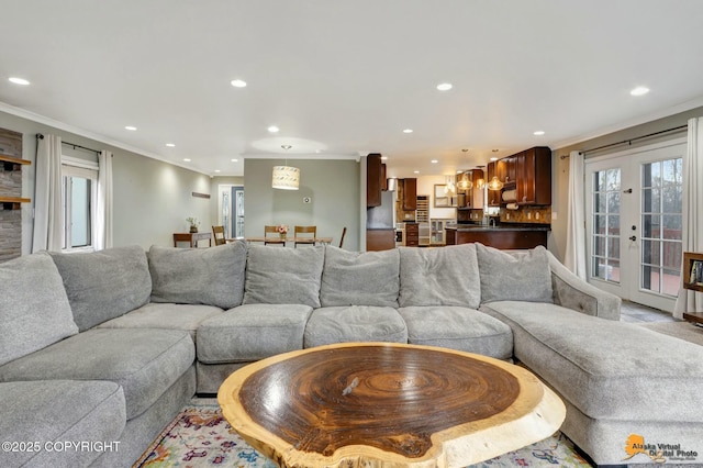 living area featuring ornamental molding, recessed lighting, and french doors