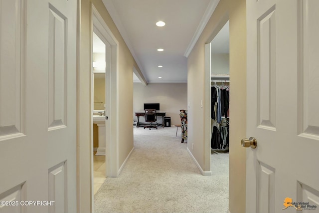 corridor with ornamental molding, recessed lighting, carpet floors, and baseboards