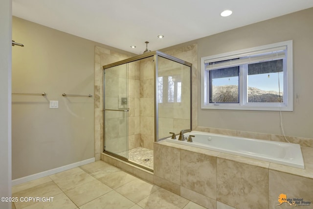 bathroom with recessed lighting, a shower stall, a bath, baseboards, and tile patterned floors