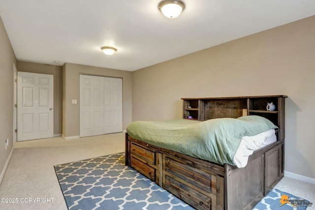 bedroom with a closet and baseboards