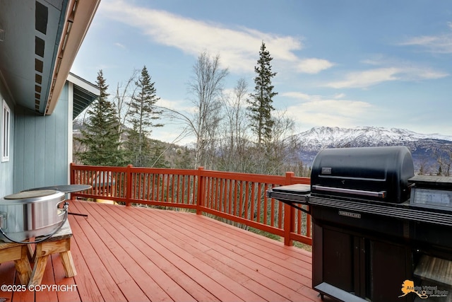 deck with central AC unit, grilling area, and a mountain view