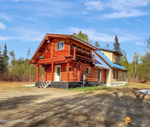 log home with covered porch