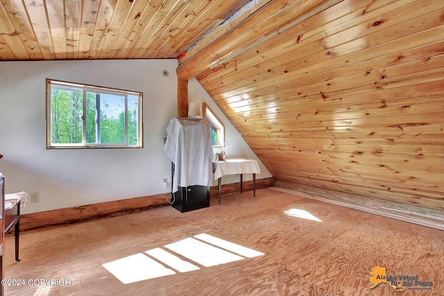 bonus room with lofted ceiling and wooden ceiling