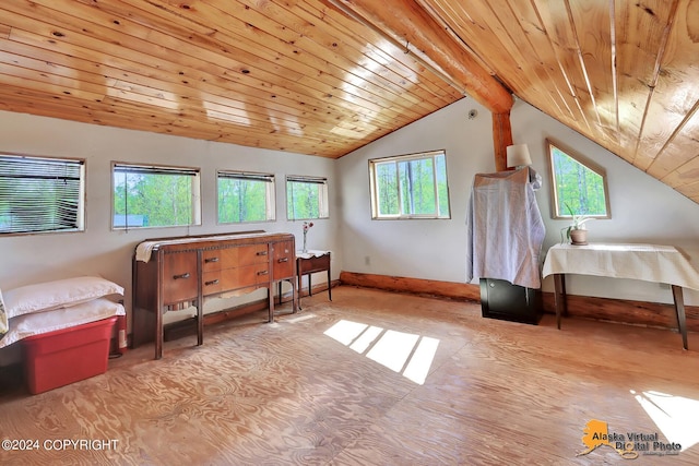 interior space featuring lofted ceiling with beams and wood ceiling