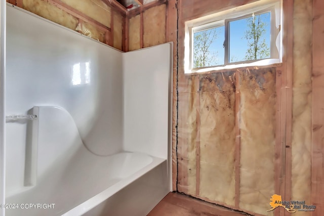 bathroom featuring a tub