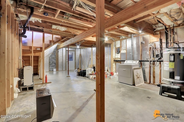 basement featuring washer / dryer and secured water heater