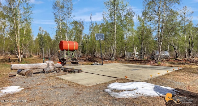 view of patio with basketball hoop