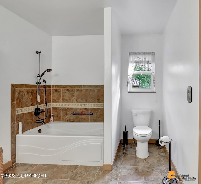 bathroom featuring toilet and a bathing tub