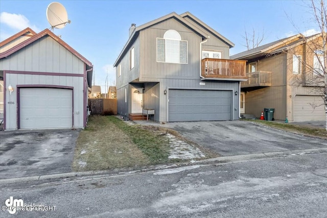 view of front of home with a balcony and a garage