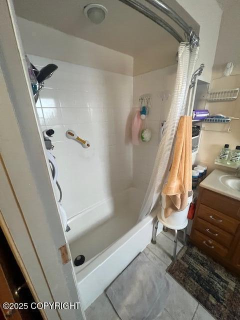 full bathroom featuring vanity and shower / bathtub combination with curtain