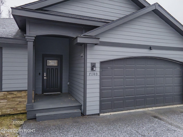 property entrance with a garage