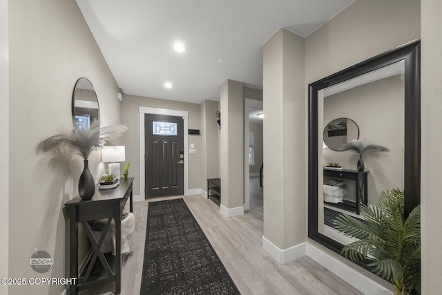 foyer entrance with light wood-type flooring