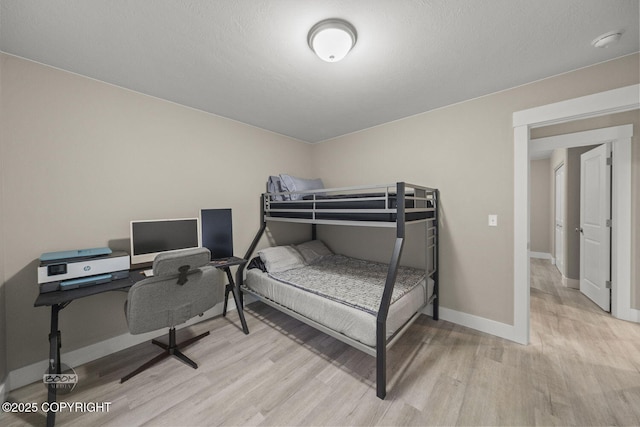 bedroom with light hardwood / wood-style floors