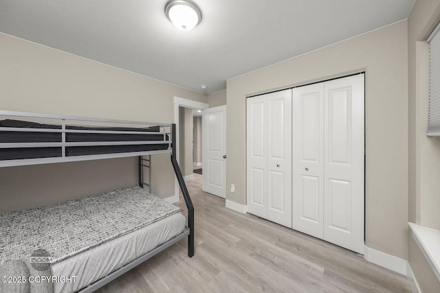 bedroom featuring a closet and light hardwood / wood-style floors