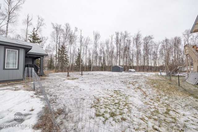 view of yard covered in snow