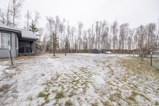 view of yard covered in snow