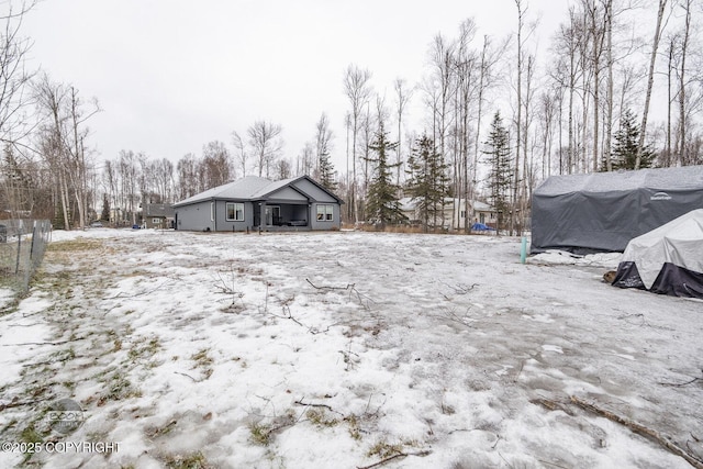 view of yard covered in snow