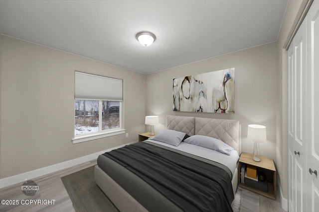 bedroom featuring a closet and hardwood / wood-style flooring