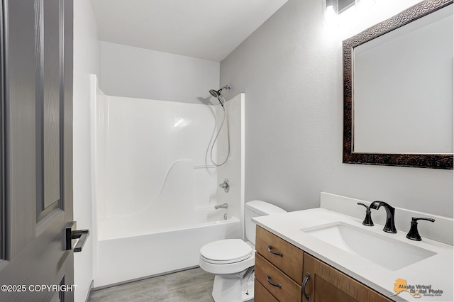 full bathroom with washtub / shower combination, vanity, and toilet