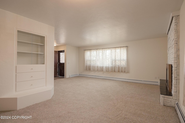 unfurnished living room featuring a stone fireplace, built in features, carpet floors, and a baseboard heating unit