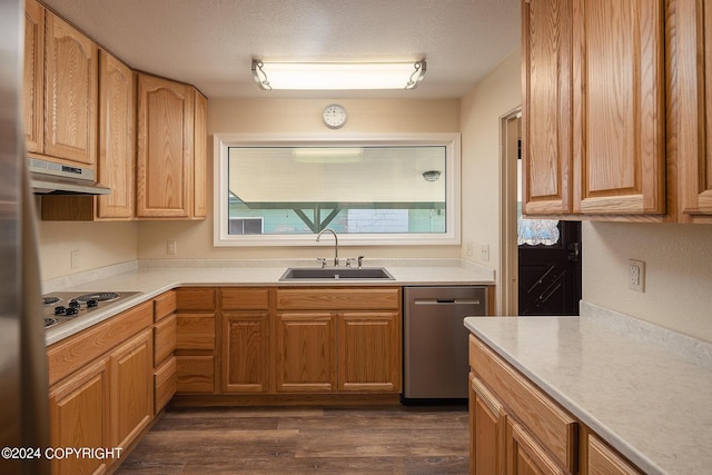 kitchen with dishwasher, sink, dark hardwood / wood-style flooring, a textured ceiling, and white electric stovetop