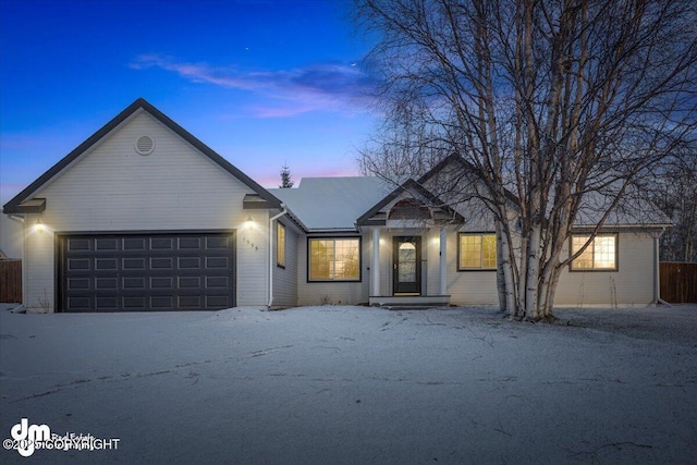 ranch-style home featuring a garage