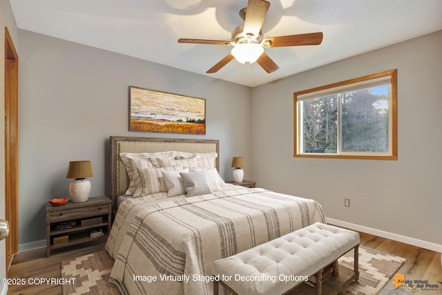 bedroom with hardwood / wood-style flooring and ceiling fan