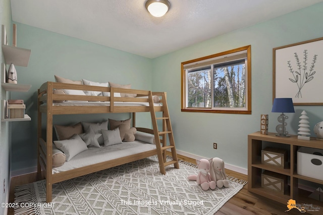 bedroom featuring wood-type flooring