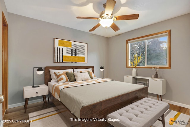 bedroom featuring hardwood / wood-style flooring and ceiling fan