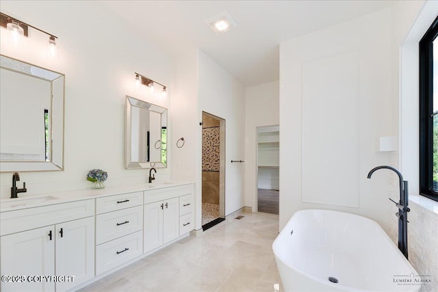 1690 W Valley Ridge Dr, Wasilla, AK 99654 - bathroom with a tile shower, double vanity, and a soaking tub