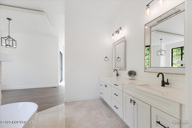 1690 W Valley Ridge Dr, Wasilla, AK 99654 - full bath featuring double vanity, a soaking tub, and baseboards