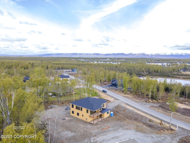 1690 W Valley Ridge Dr, Wasilla, AK 99654 - drone / aerial view of a forest and a mountain backdrop