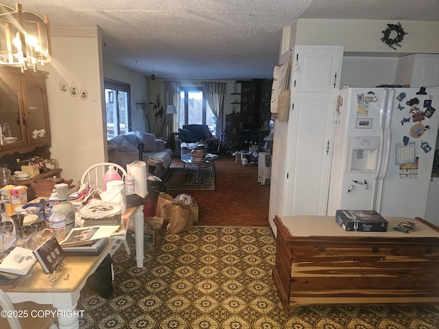 8400 George Ct, Anchorage, AK 99516 - interior space featuring a textured ceiling and white refrigerator with ice dispenser