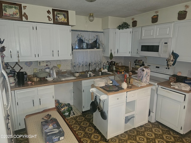 8400 George Ct, Anchorage, AK 99516 - kitchen with white cabinets, white appliances, and sink
