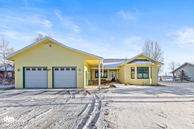 ranch-style home with a garage