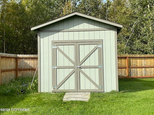 view of outdoor structure with a lawn