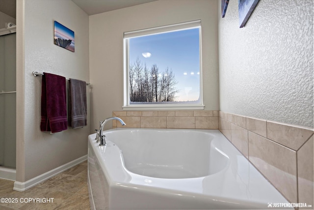 bathroom featuring tile patterned flooring and a washtub