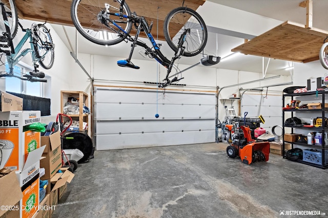 garage featuring a garage door opener