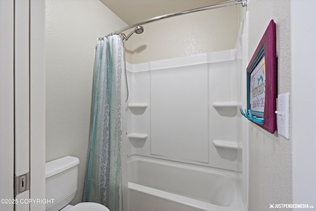 bathroom with shower / tub combo with curtain and toilet