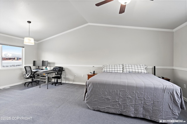 carpeted bedroom featuring ornamental molding, lofted ceiling, and ceiling fan