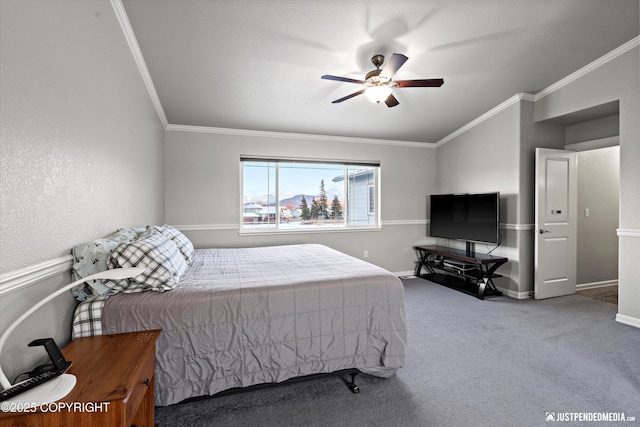 carpeted bedroom with ceiling fan and ornamental molding