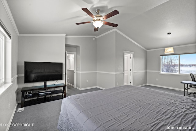 carpeted bedroom with vaulted ceiling, ceiling fan, and crown molding