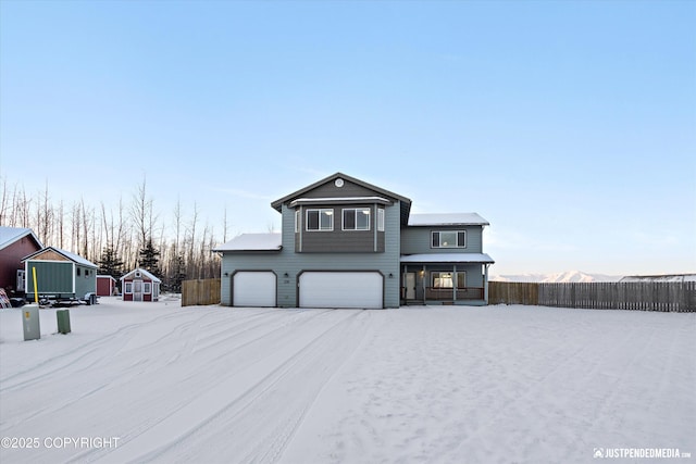 view of front property with a garage and a porch